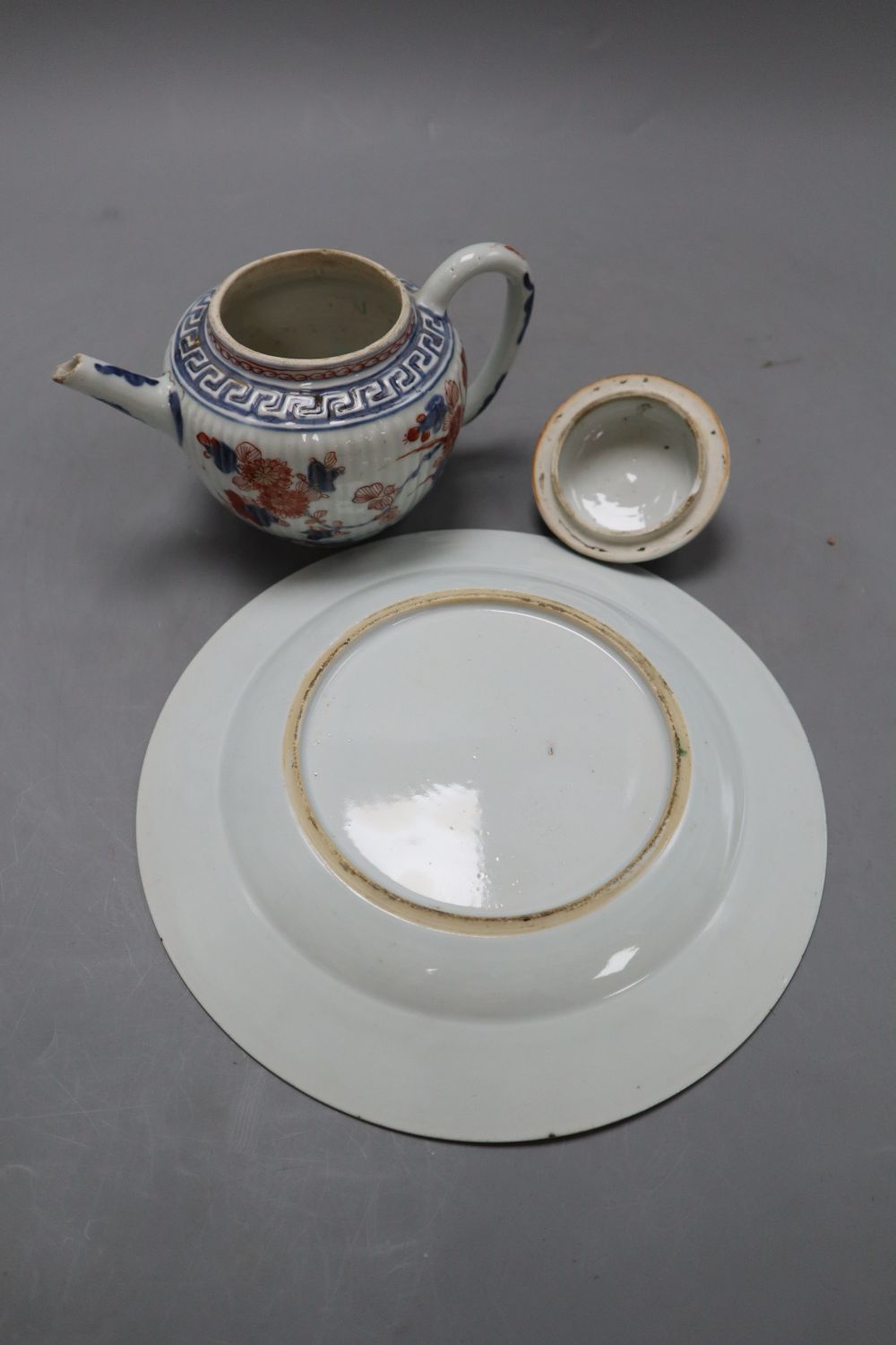 A 18th century Chinese famille rose dish, diameter 23cm, and an Imari porcelain teapot